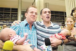 The twins, Itai and Liron, with their parents arriving in Israel